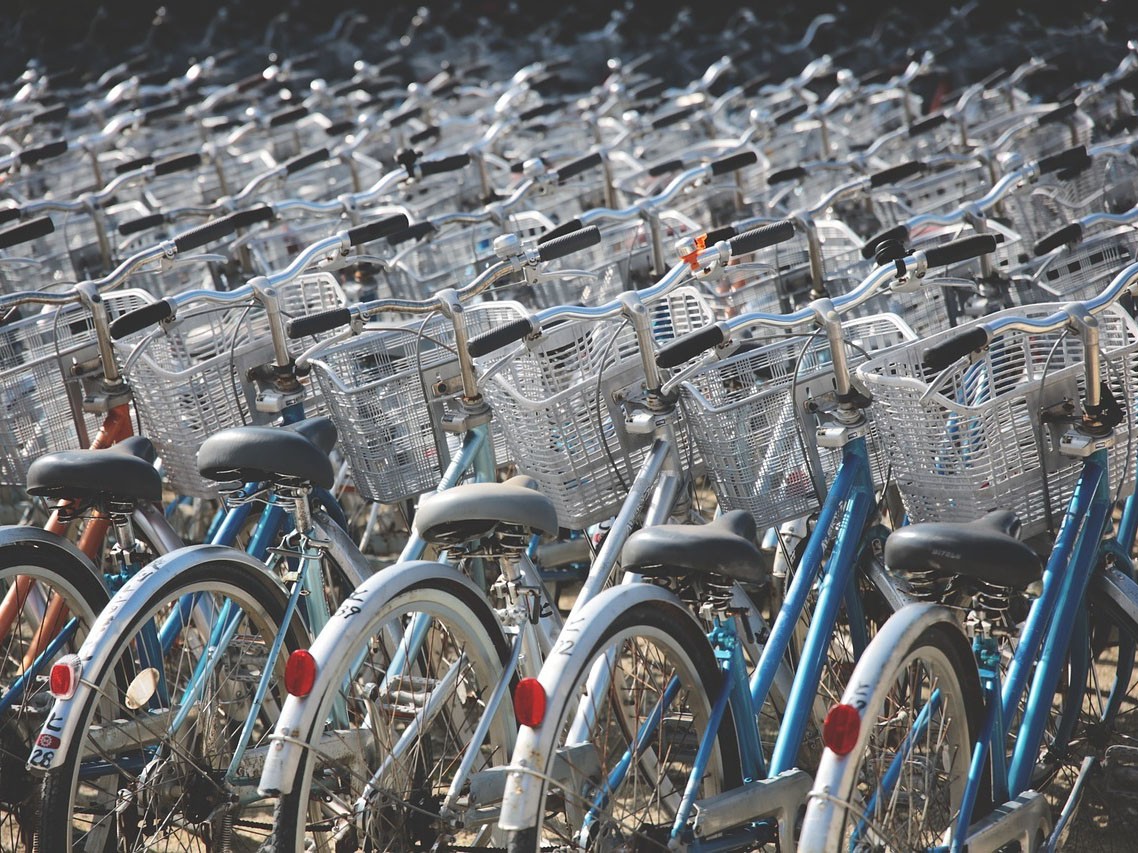 Many parked bycicles