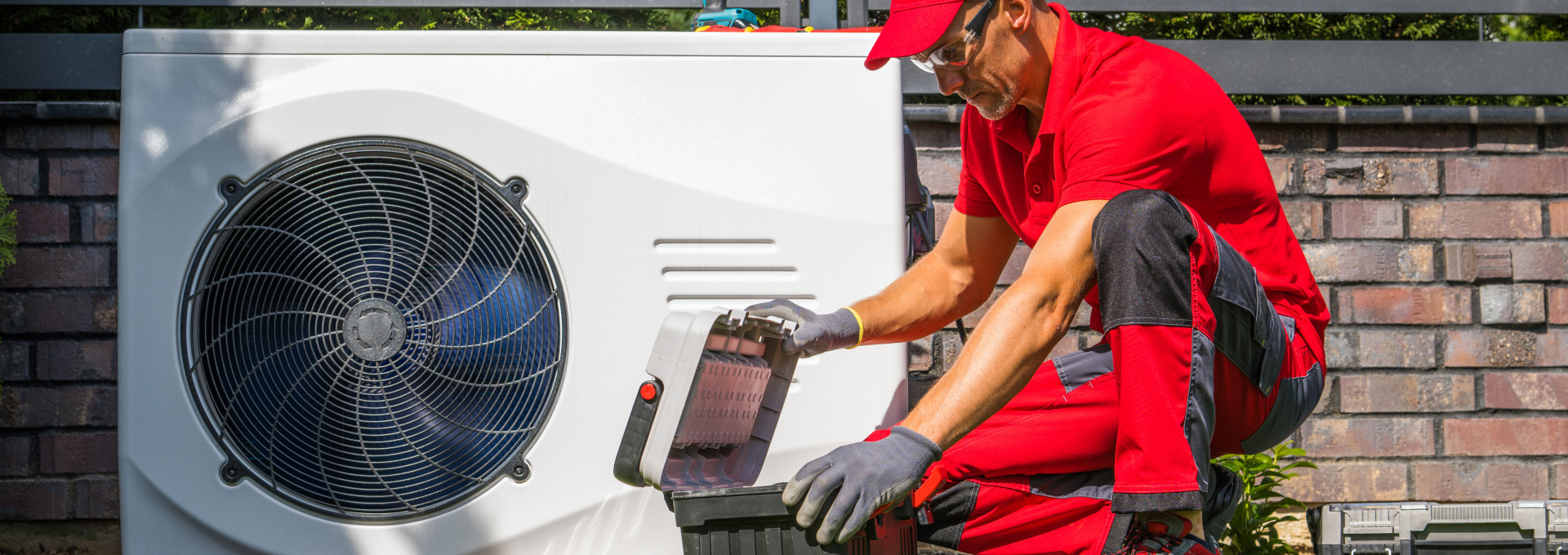 Technician installing a heat pump