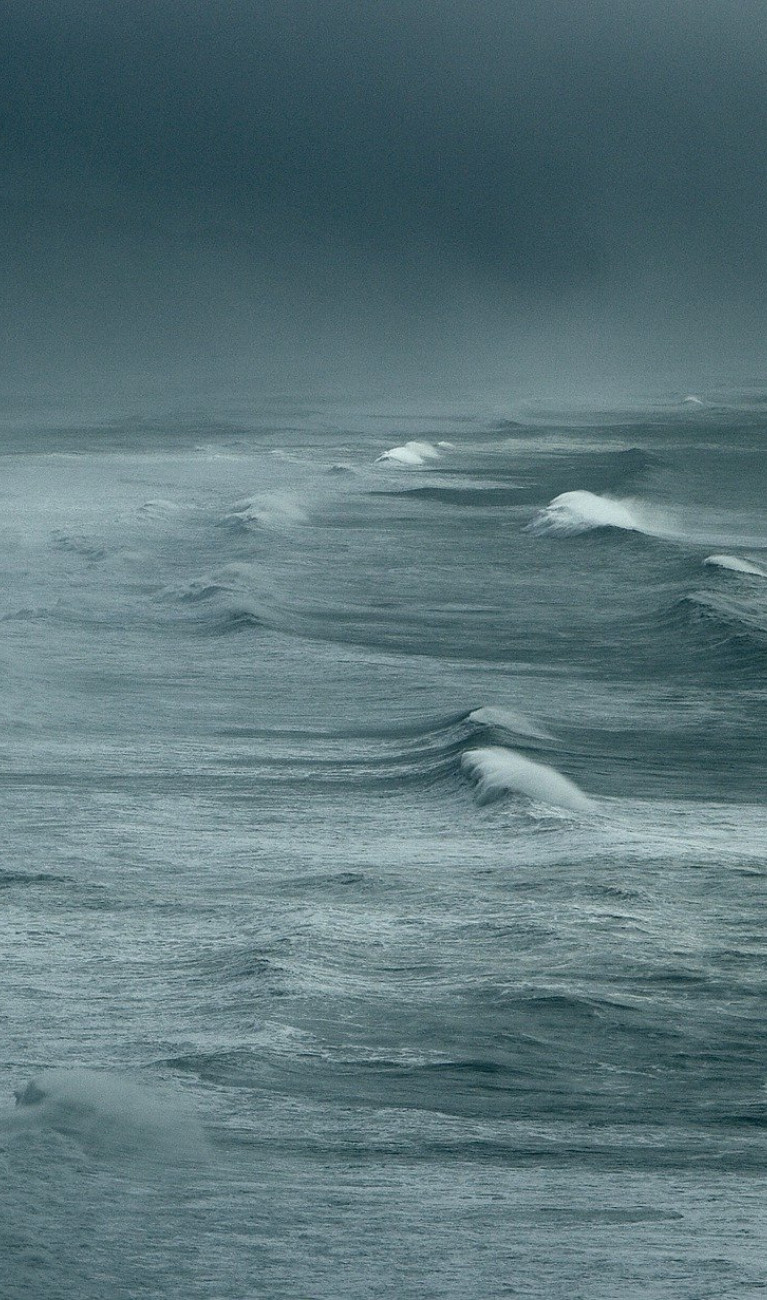 A stormy sea under a grey sky