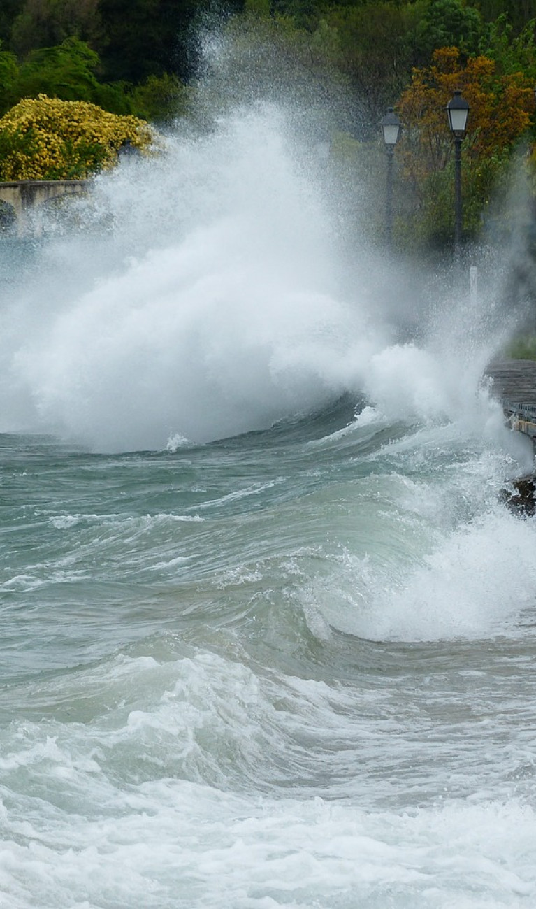 Big wave crashing against seafront