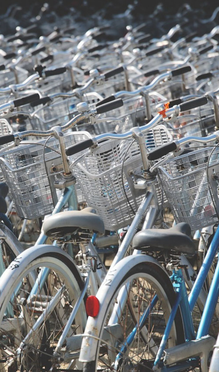 Many parked bycicles