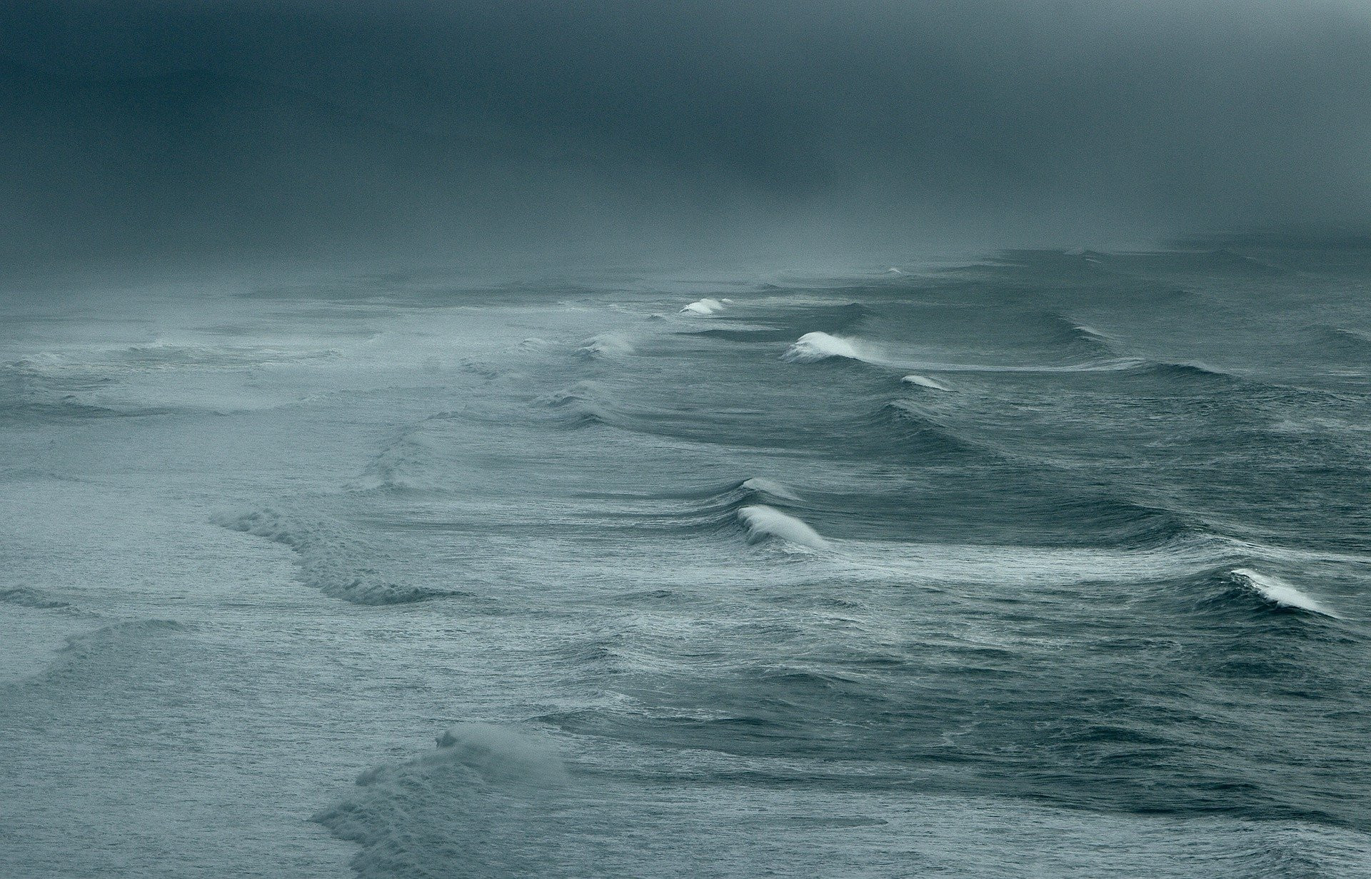 A stormy sea under a grey sky