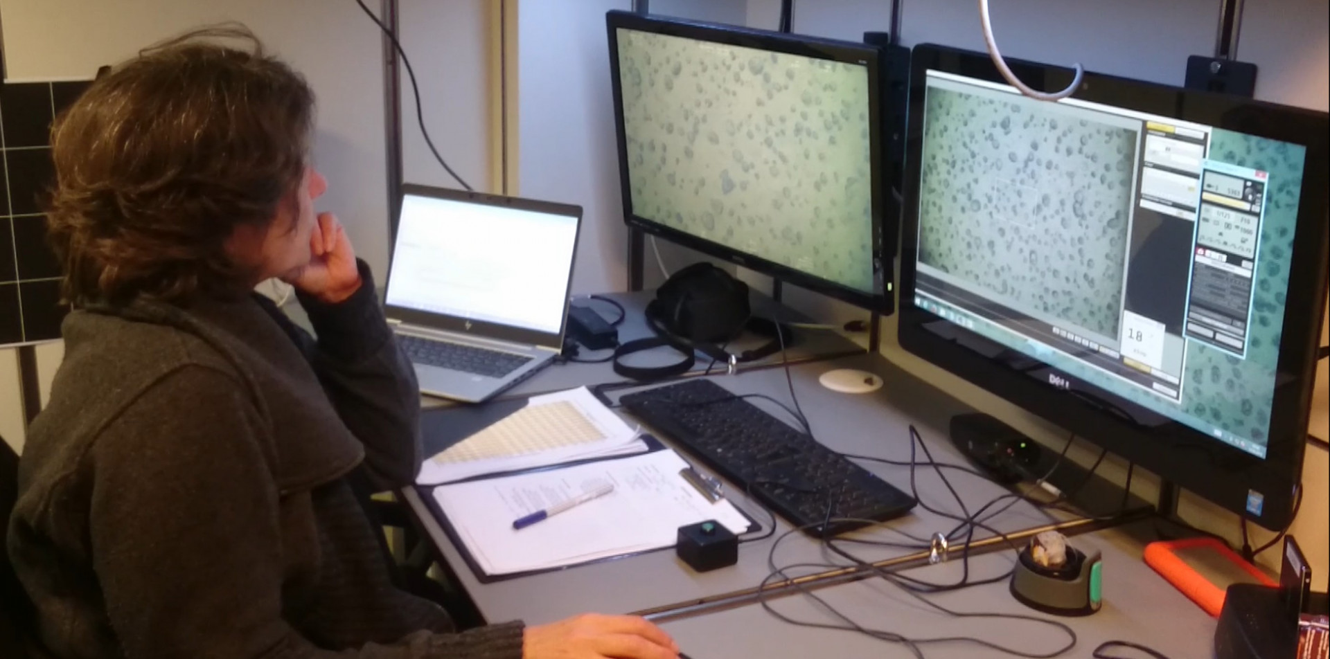 Melanie Bergmann in front of computer screens on a research vessel